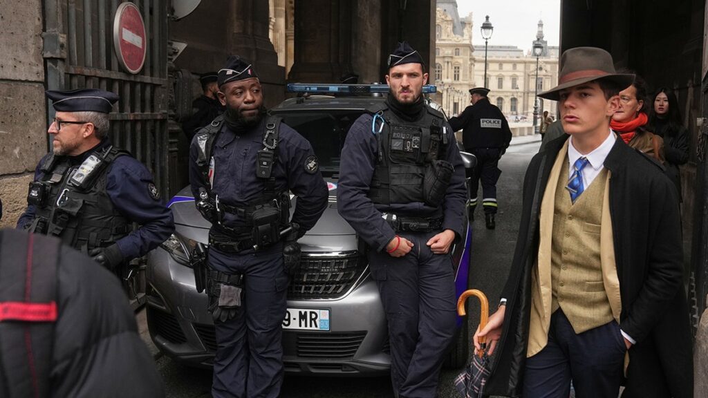 Brave stranger in photo of crown jewels heist in Paris sparks online buzz